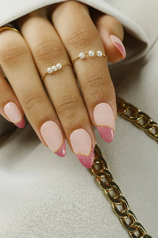 Pink cat eye french press on nails

These is our cat eye press on nails set named PETAL GLOW. These nails carry a double french on its top the first one pink cat eye french tip and second one is golden chrome french tip nails. This cat eye set has different design on each finger and also on the thumb.