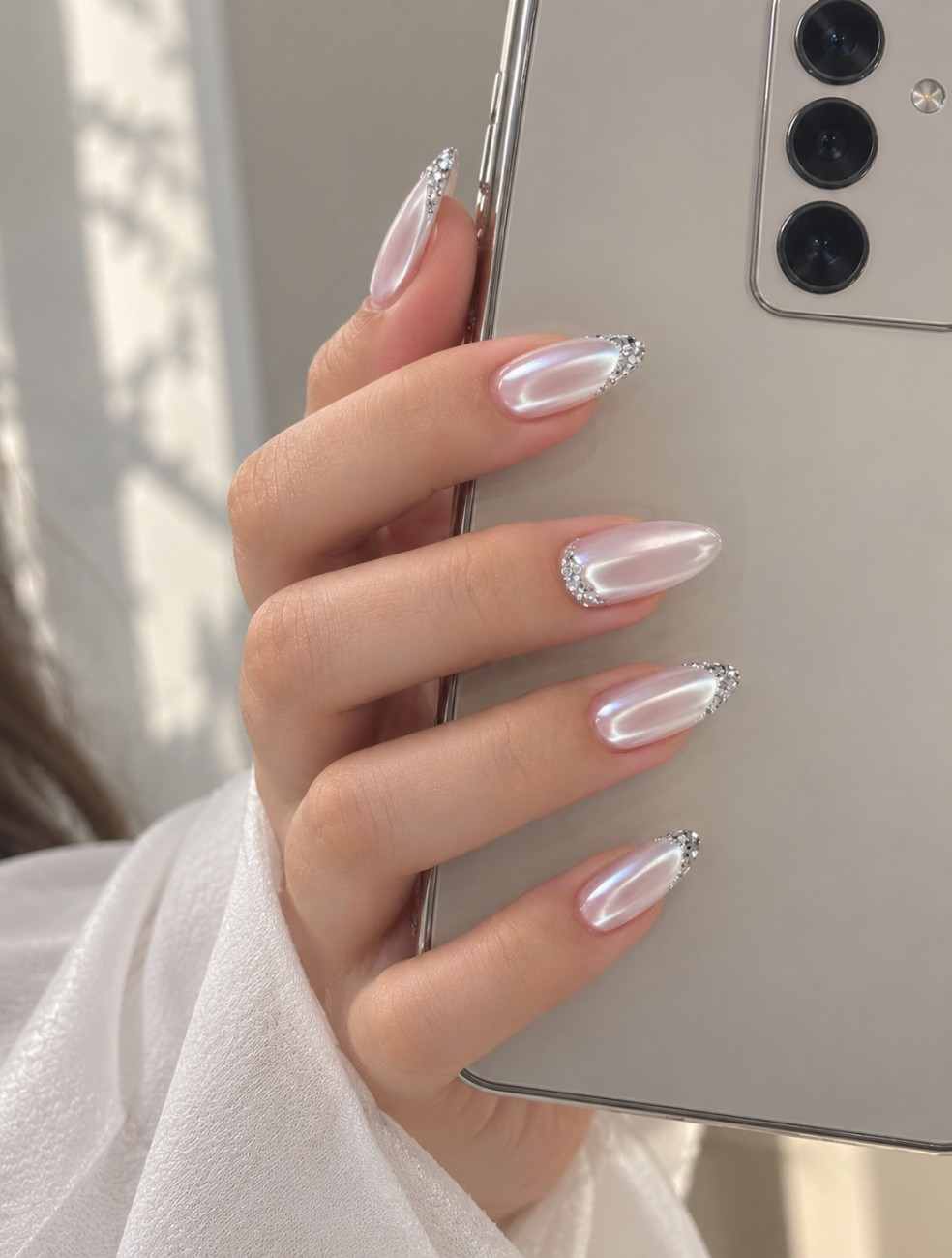 Angel Glaze press-on nails worn on hand