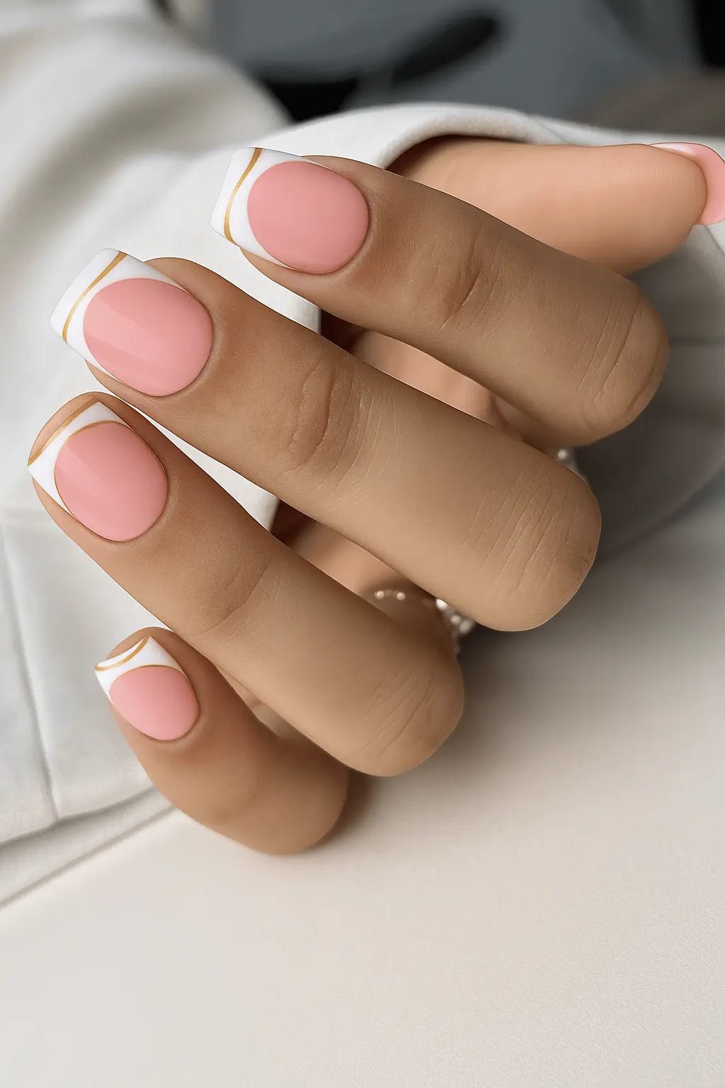 Close-up of white and gold chrome french manicure nude pink artificial fake nails online