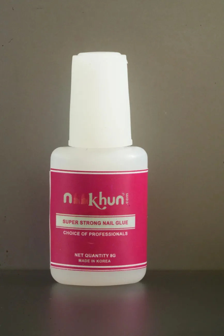 Brush-on nail glue for secure press-on nail application