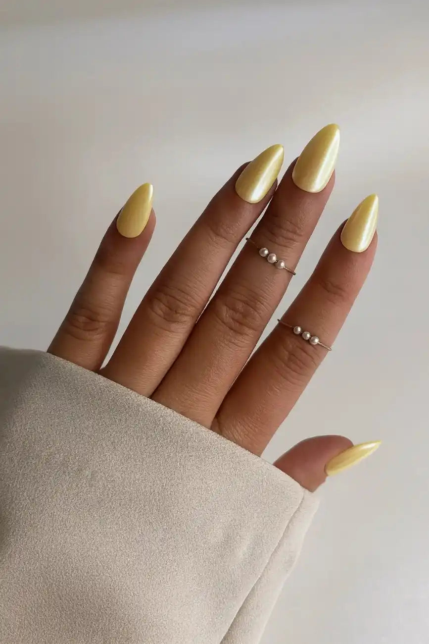 Soft butter yellow press-on nails with an elegant glossy finish
