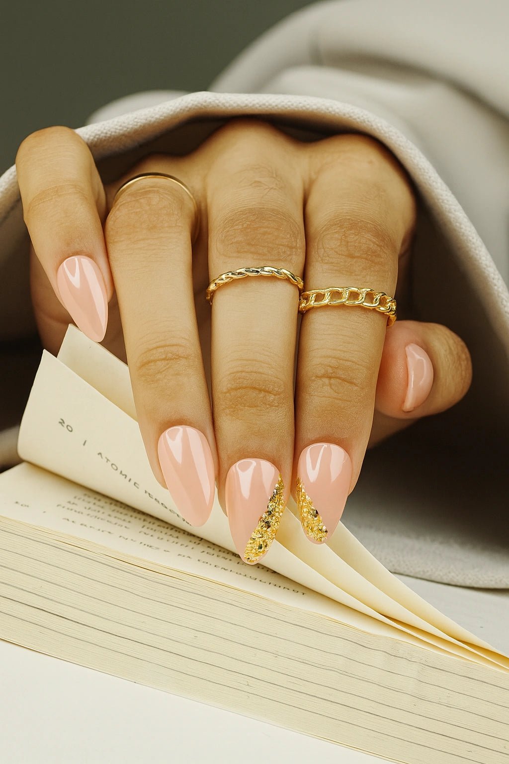 This set is covered with the nude pink base colour design with a gold foil side french design on the tip