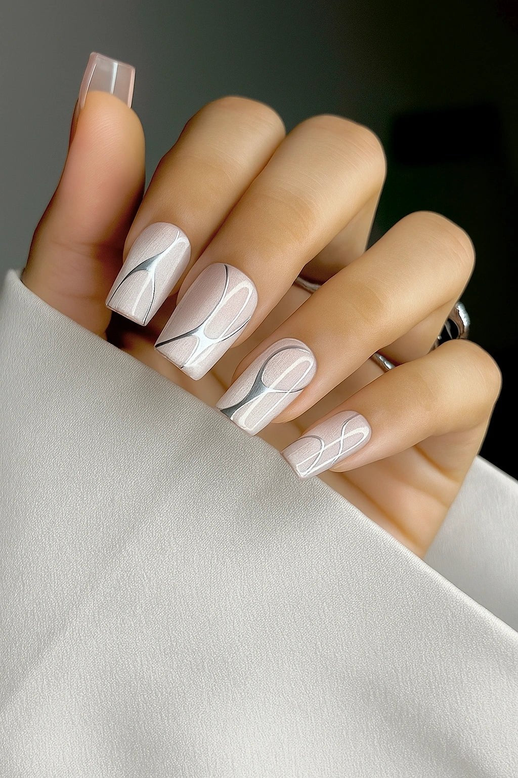 chrome nail art extension on nude cat eye press on nails