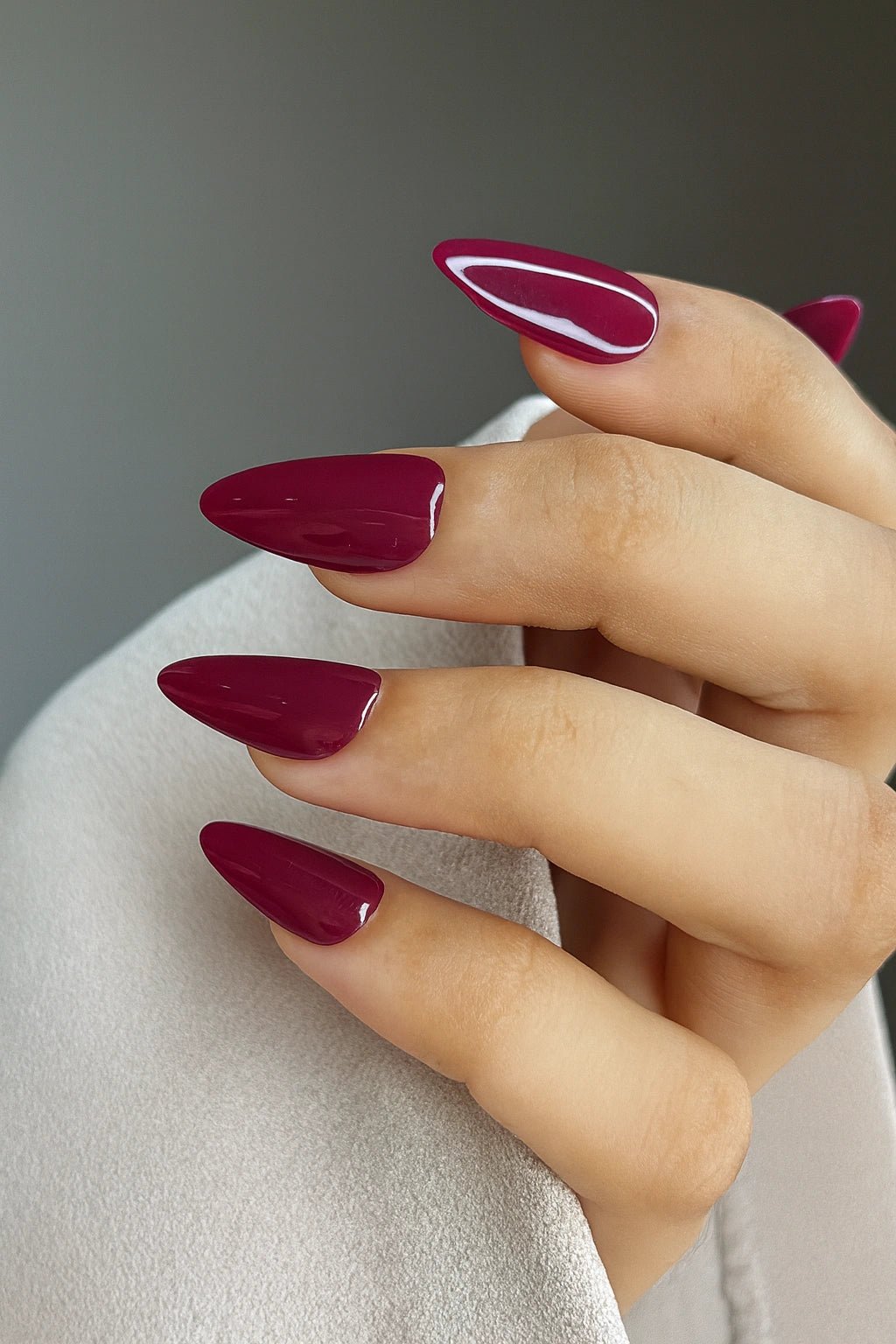 closeup of wine red bridal press on nails