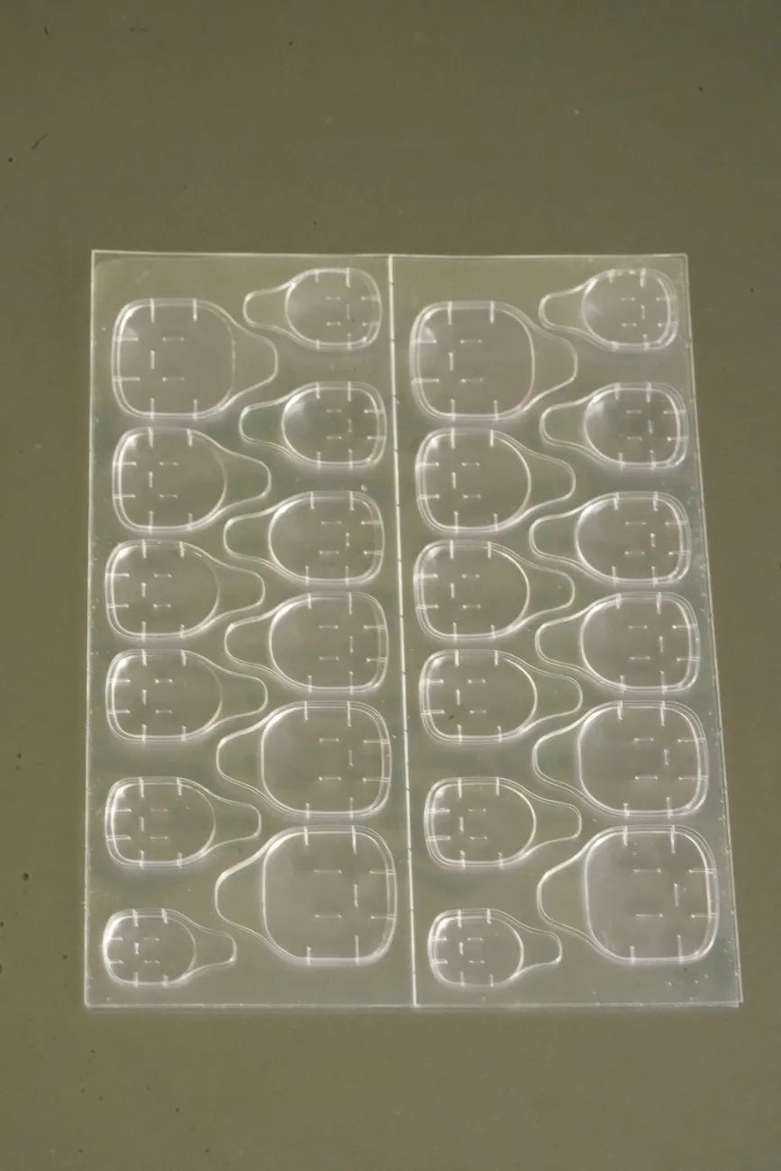 Double-sided nail glue tabs for reusable press-on nails