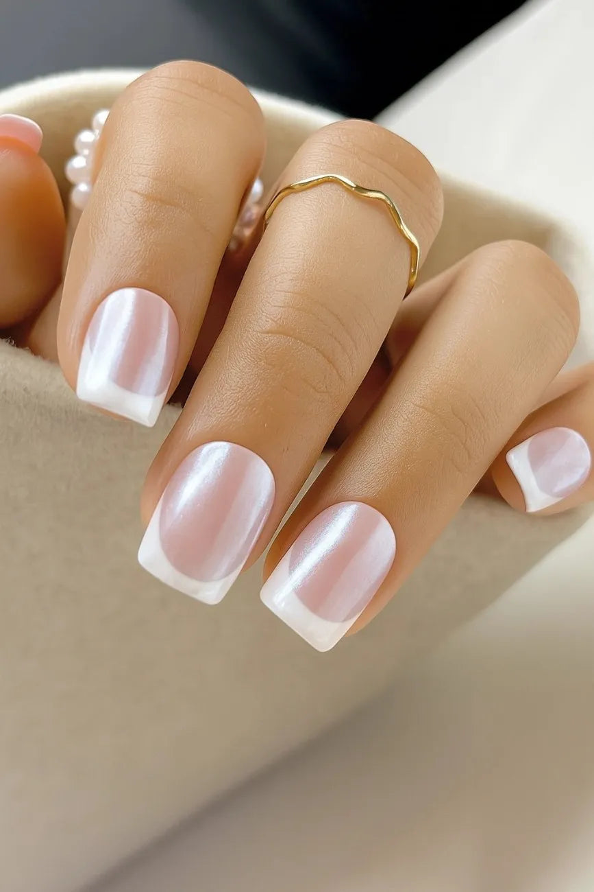 Close-up of Glass French nails highlighting the transparent glossy French tip finish