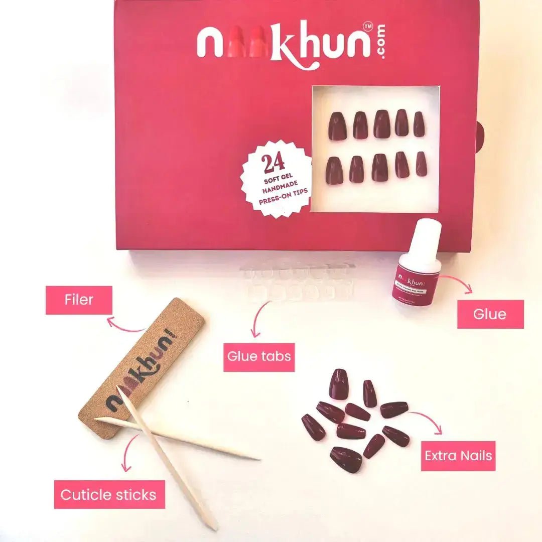 Golden Fire nail kit including press-on nails, glue, tabs, nail file, and cuticle sticks