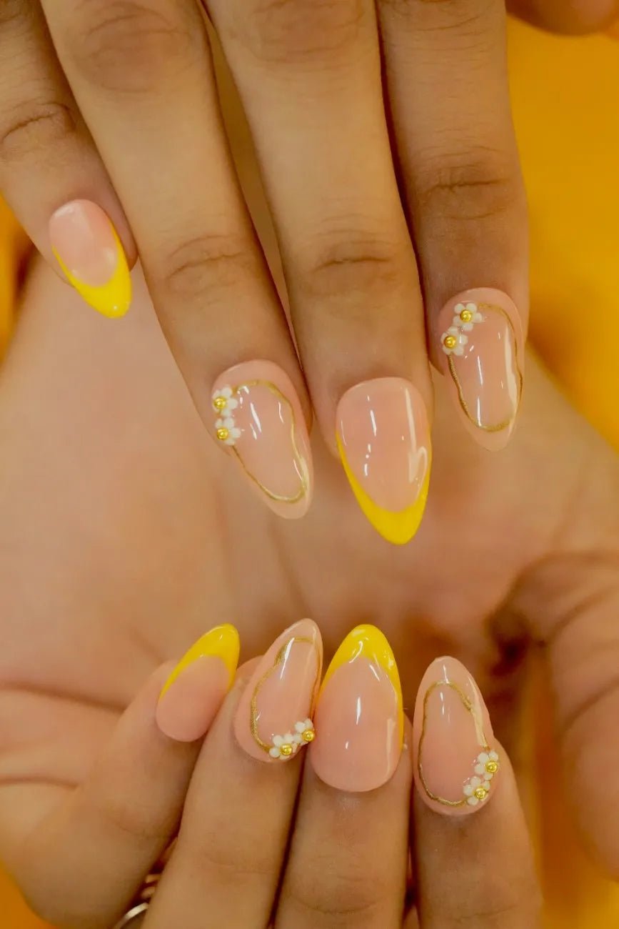 Golden-toned press-on nails with elegant salon-quality finish