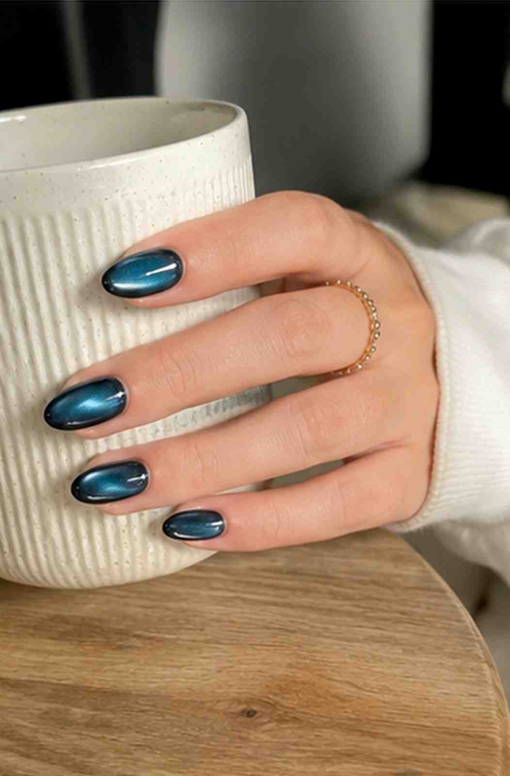 Front view of Green Galaxy press-on nails featuring a vibrant green magnetic cat-eye design.