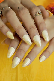 Haldi nails for bride in lemon yellow shade, perfect for pre-wedding ceremony look.