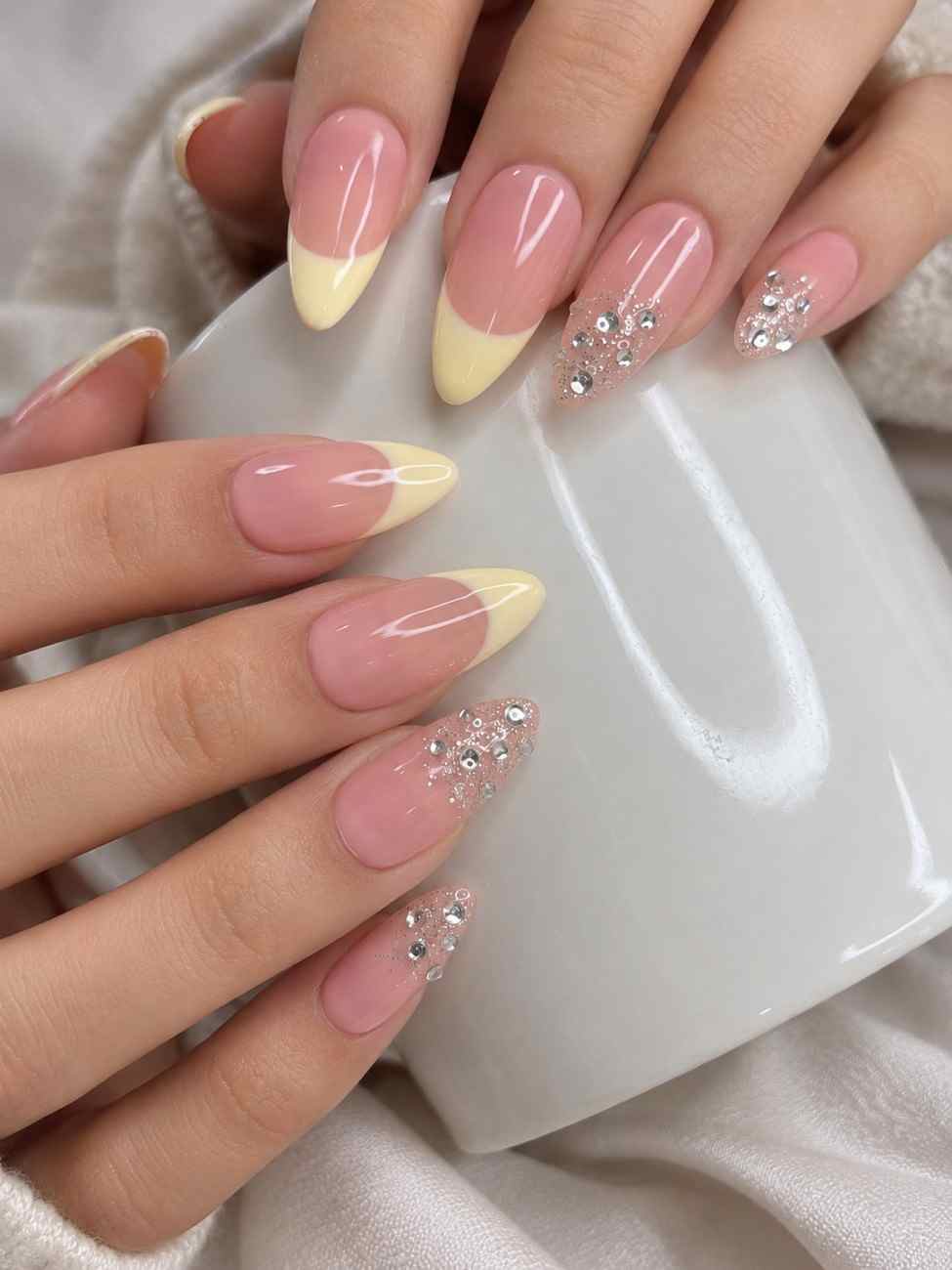 Lemon Crystal yellow press-on nails worn on hand