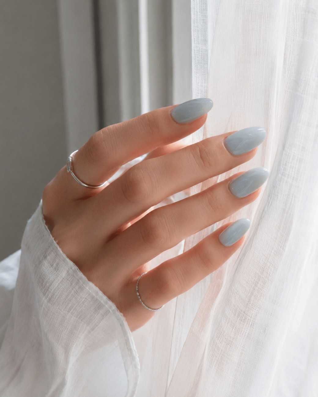 Close-up of Little Luxurious nails highlighting delicate details and glossy finish