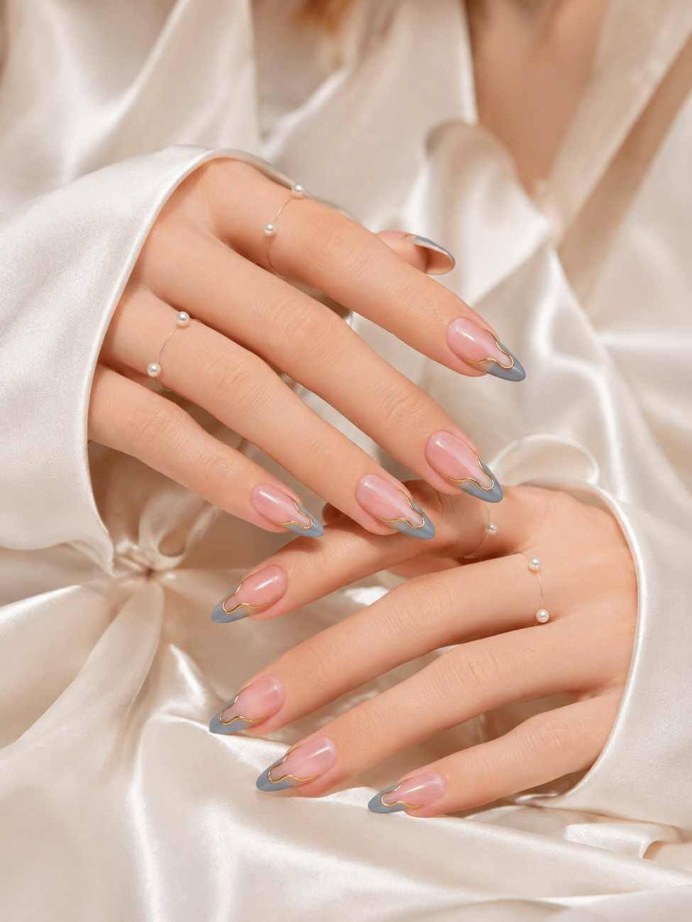 Luxe Aura blue press-on nails worn on hand