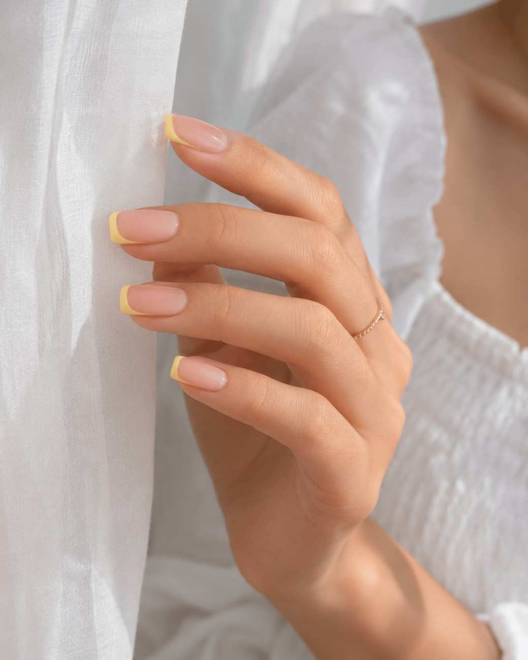 Mango Milk reusable press-on nails worn on hand