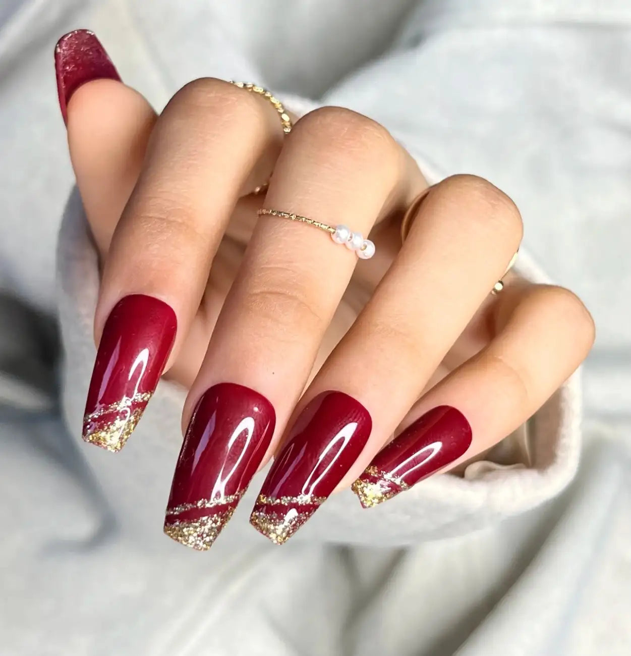 Front view of Maroon Sparks press-on nails featuring deep maroon tones and sparkle