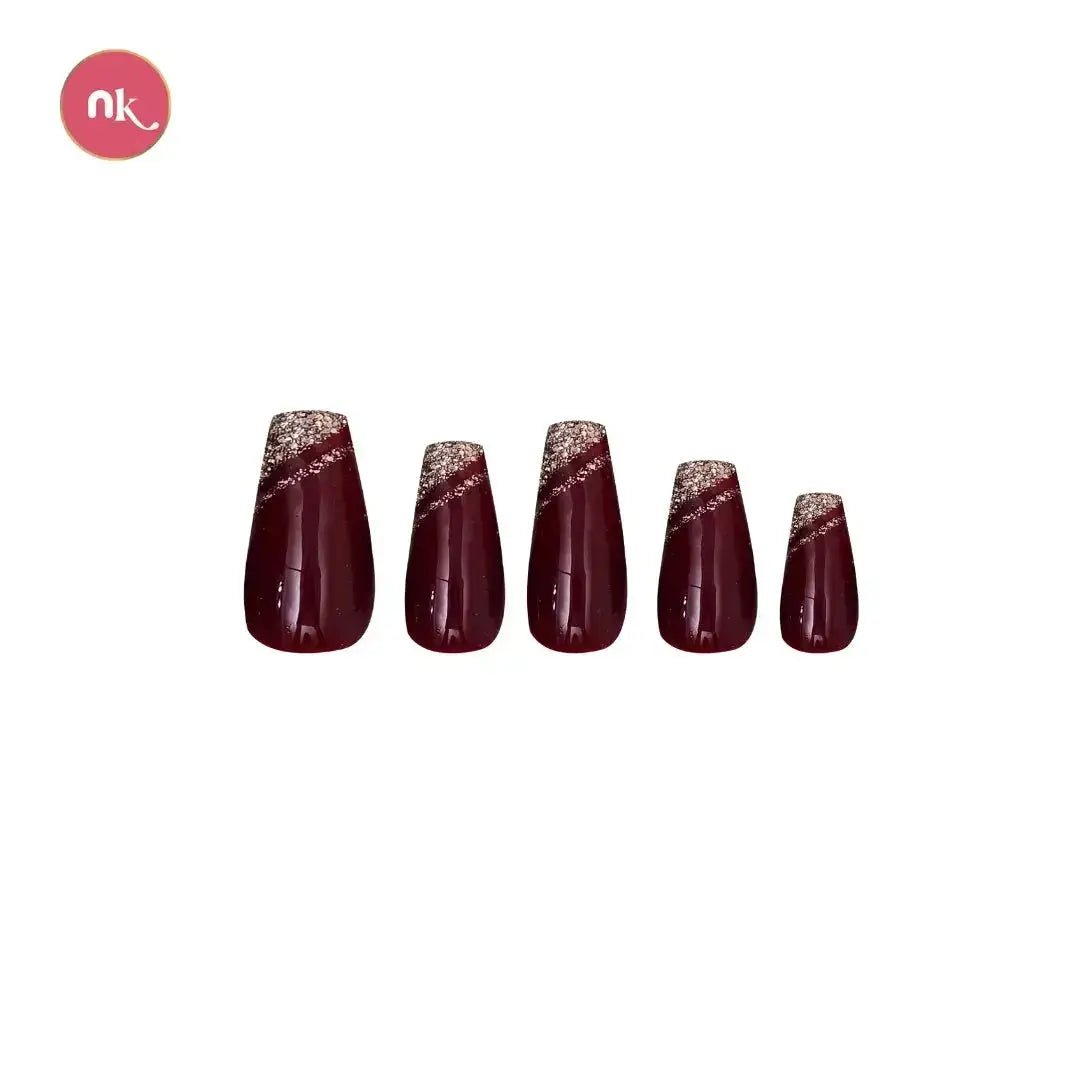 Close-up of Maroon Sparks nails highlighting glitter accents and glossy finish