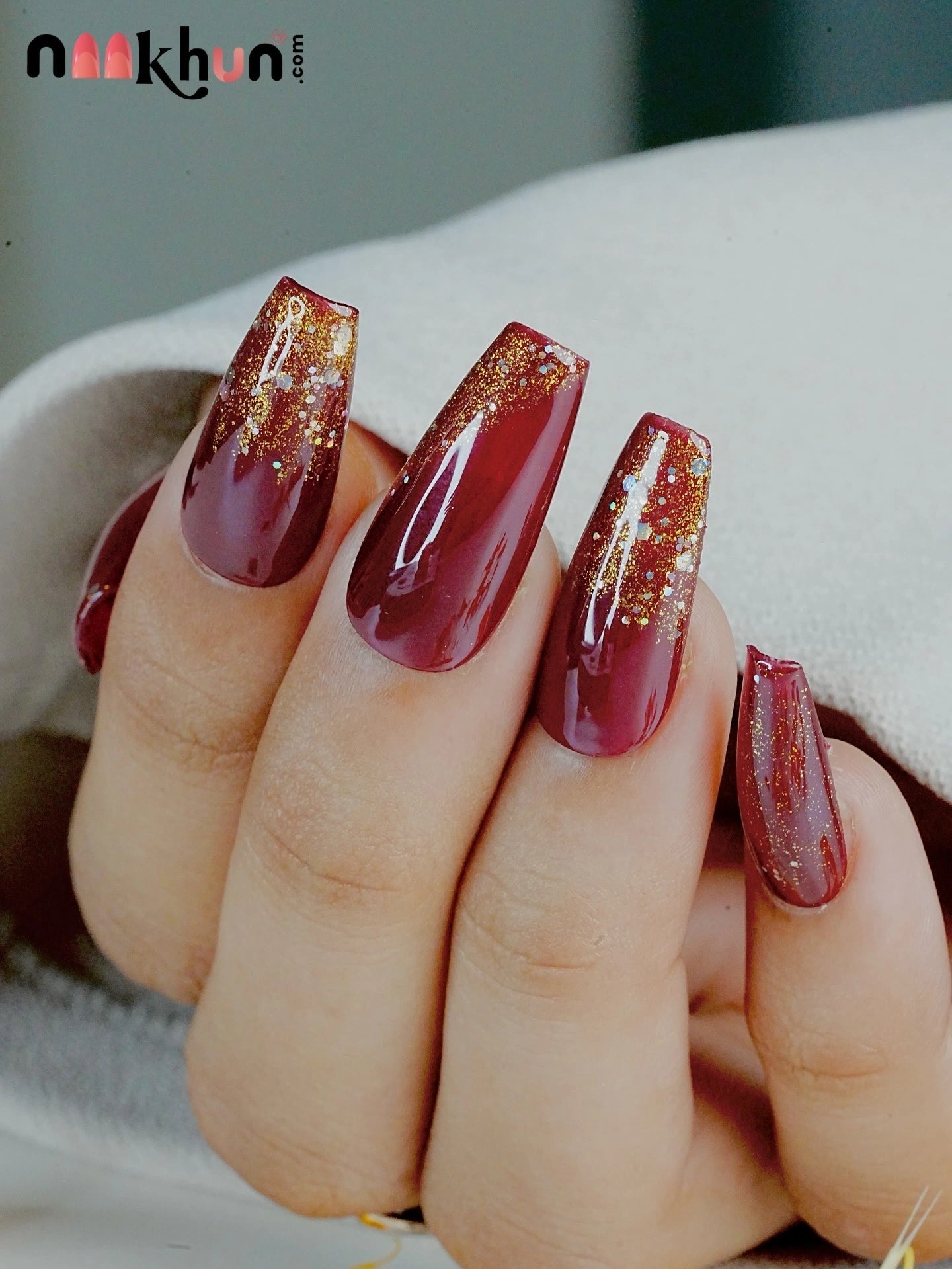 maroon with golden 
glitter french tip press on nails