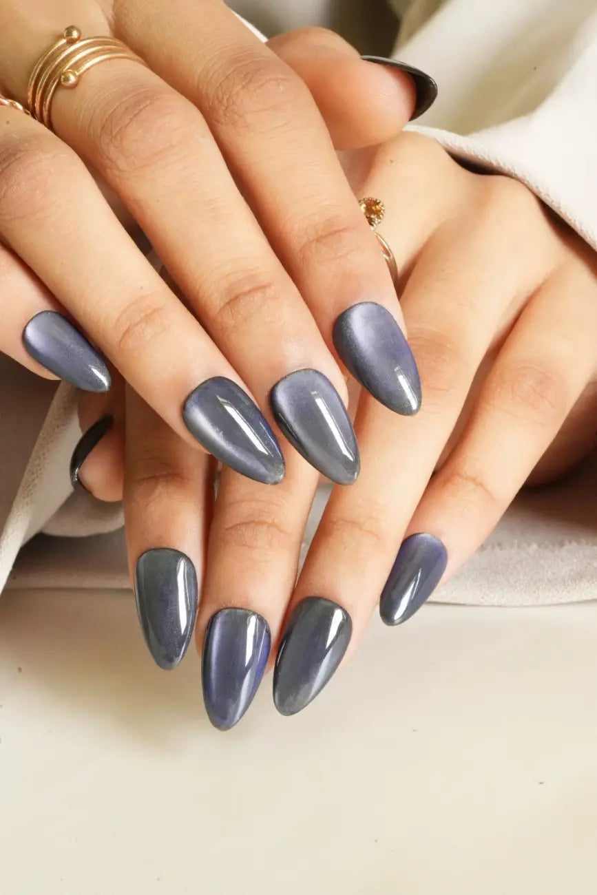 Glamorous dark press-on nails inspired by the night sky