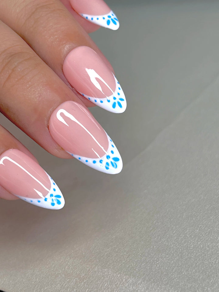 Pink French manicure press-on nails with classic white tips