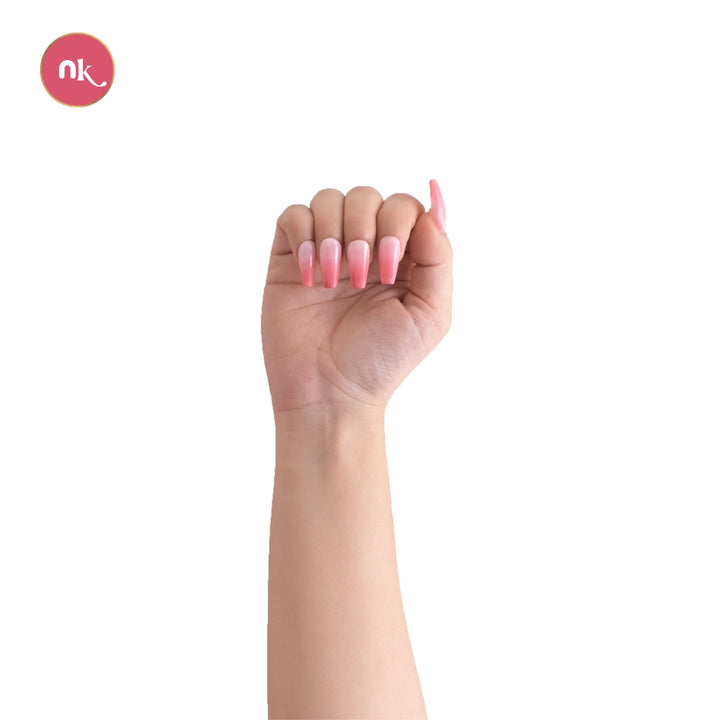 Showing how these artificial white and pink ombre coffin stick on fake soft gel press on nails look like after applying onto your hand.