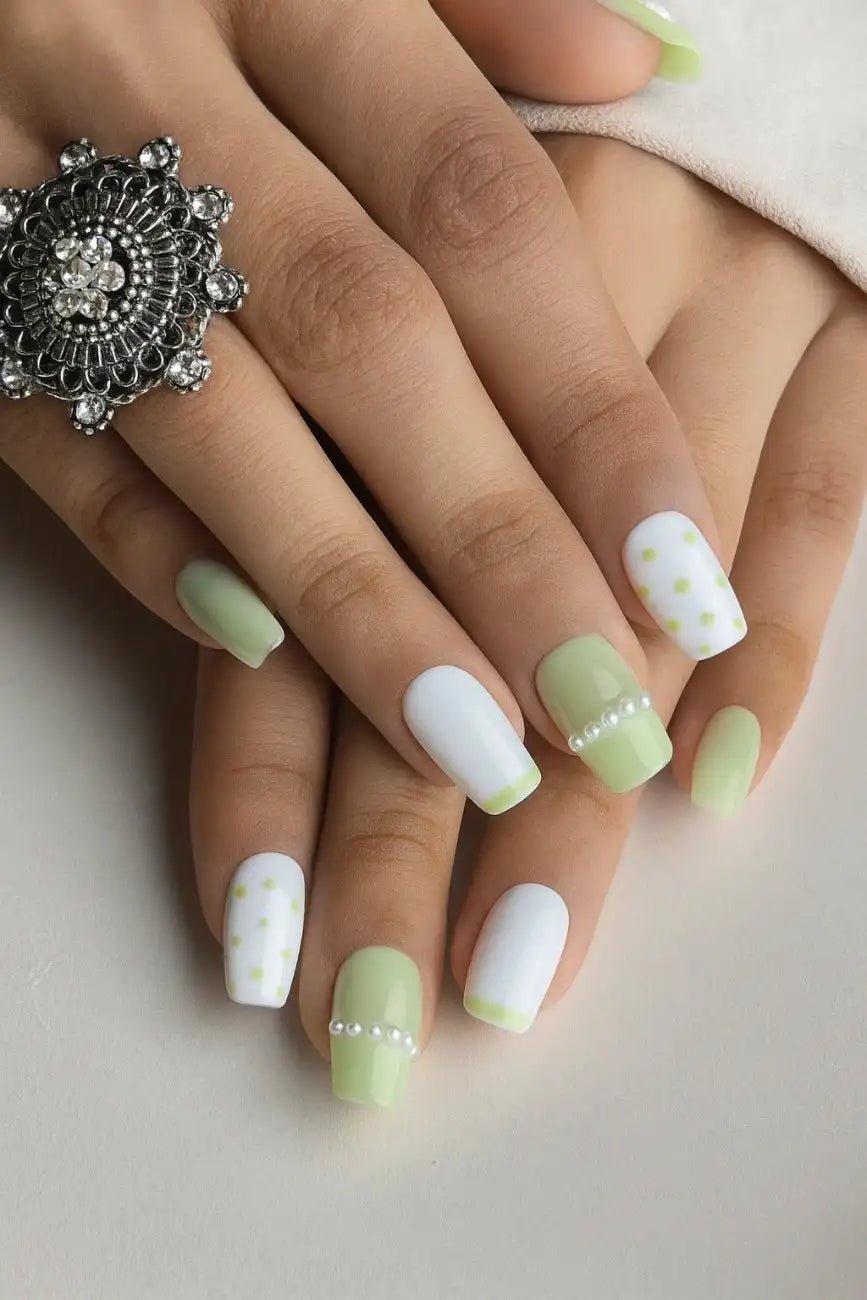 Elegant pearl-inspired press-on nails with polka dot details