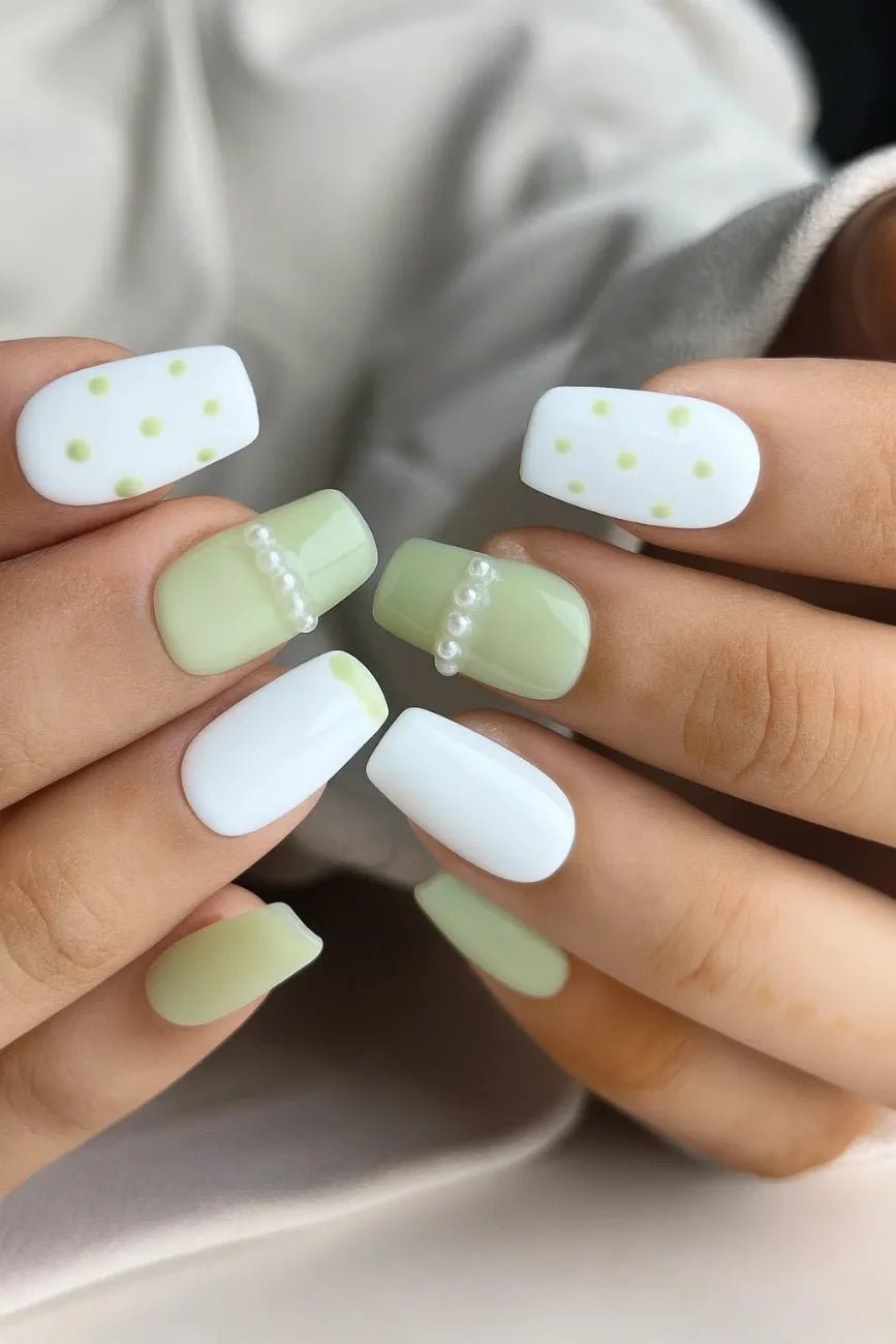 Polka Pearl reusable press-on nails worn on hand