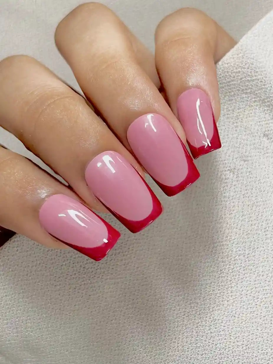 Red Crush reusable press-on nails worn on hand