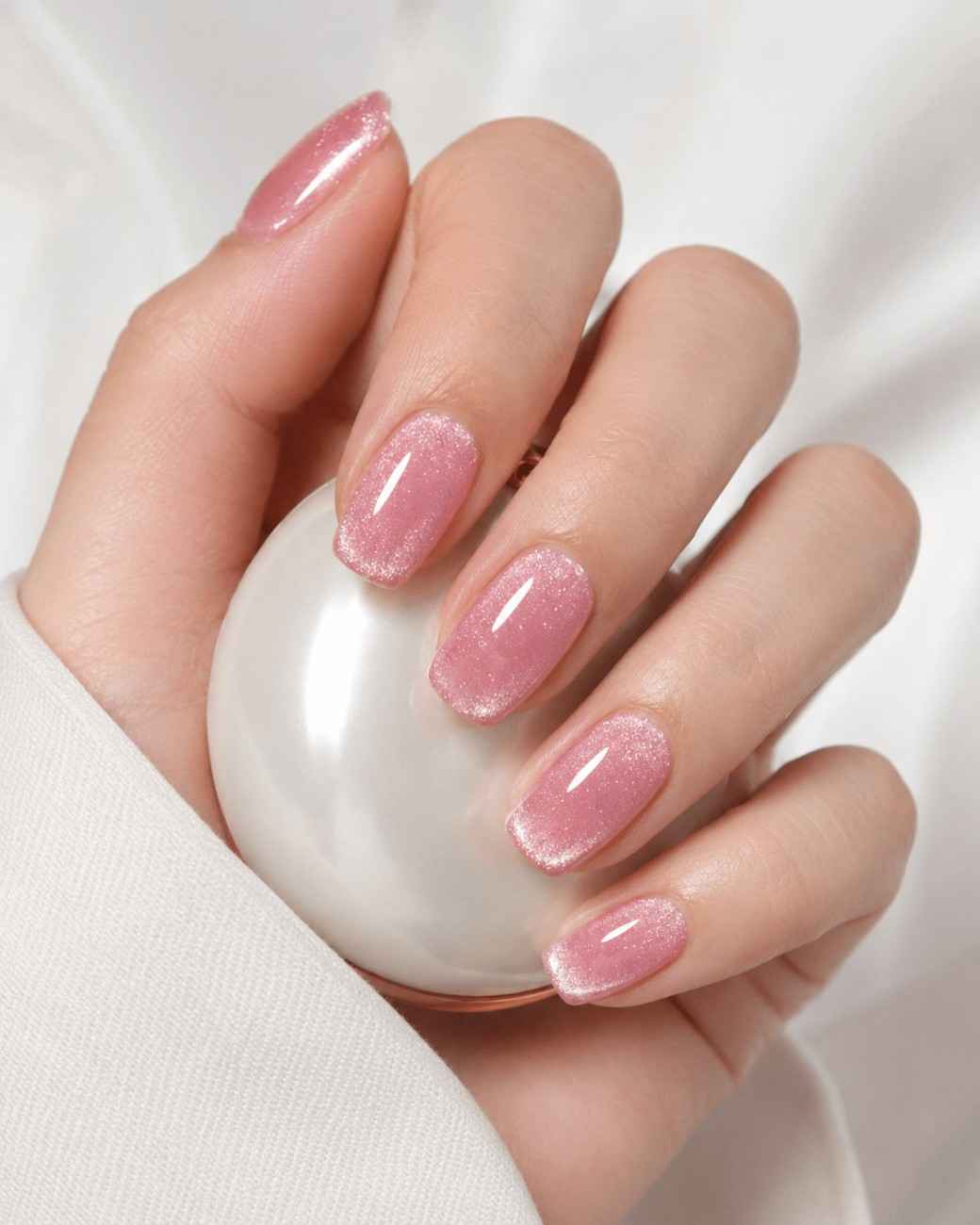 Rose Cat Eye handmade soft gel press-on nails with a shimmering rose pink cat-eye effect by Naakhun.