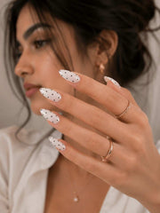 Spotlight white press-on nails with dot design by Naakhun.com