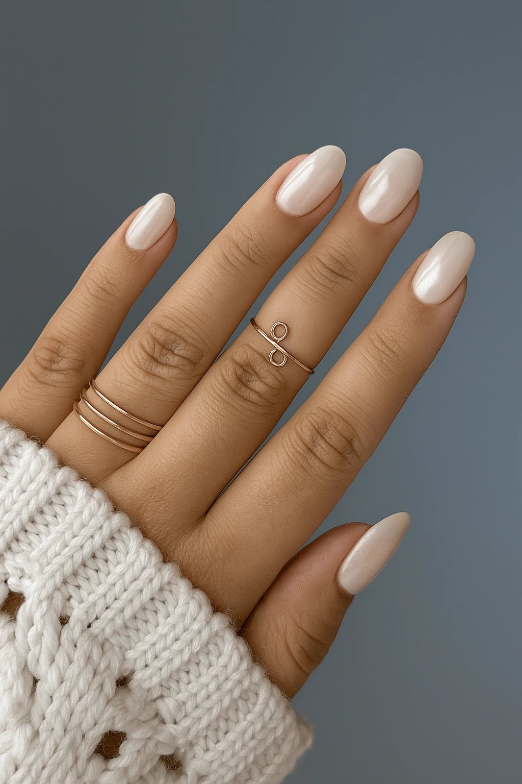 showing how these White silver chrome short round fake press on nails look in light their fall in look
